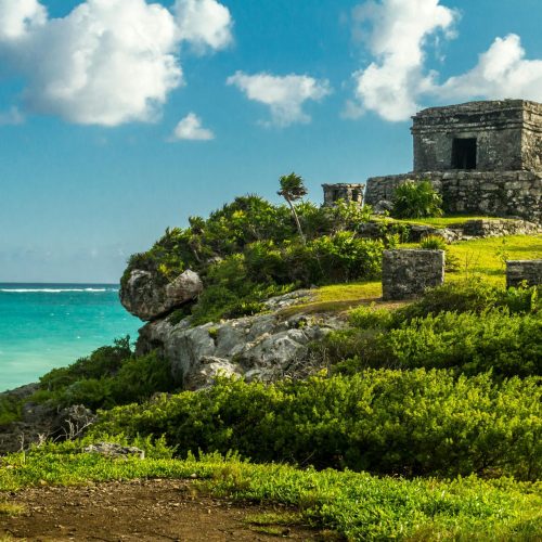 The ruins of Tulum are perched on a cliff overlooking the Caribbean Sea.